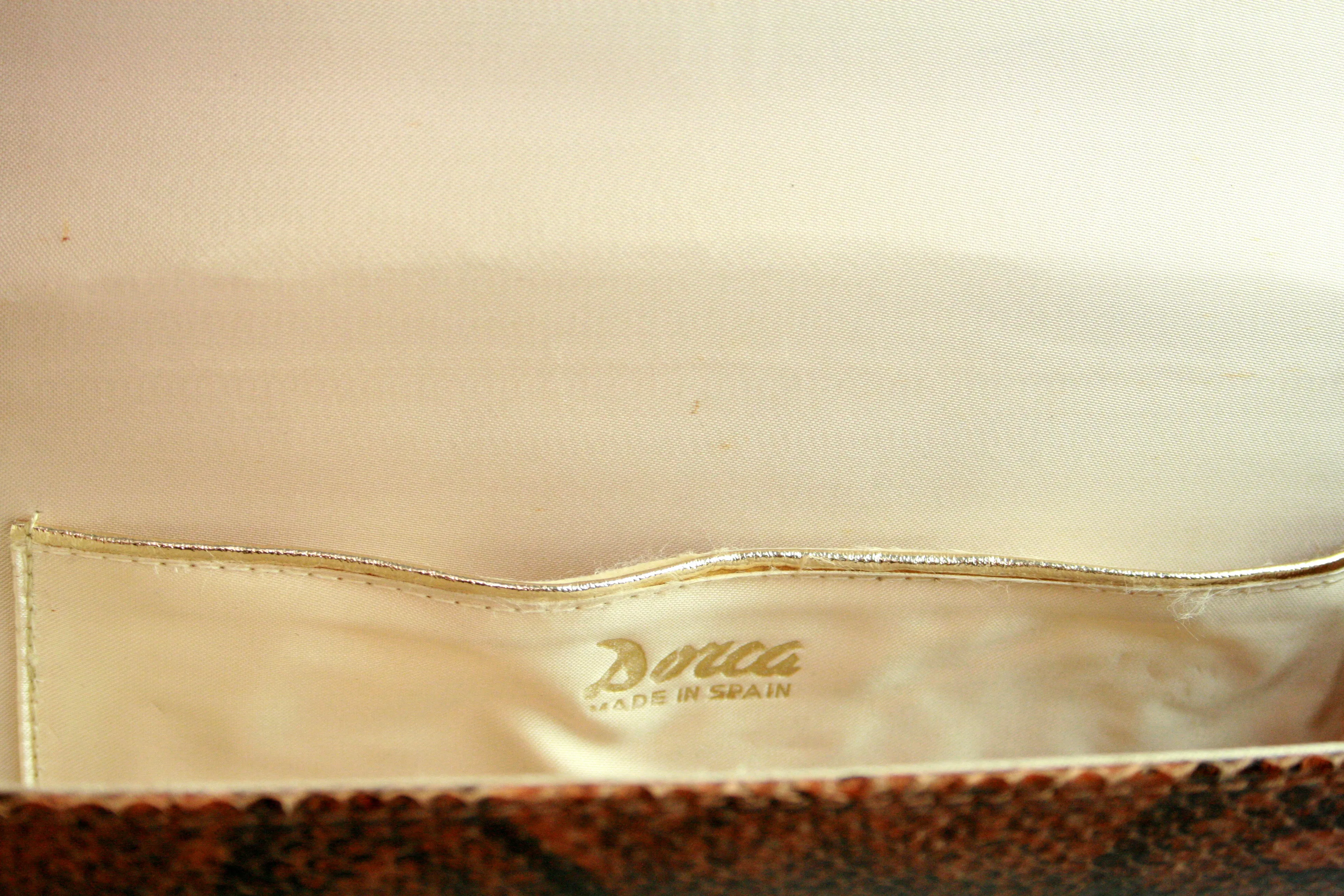 DORCA orange-brown snake skin clutch